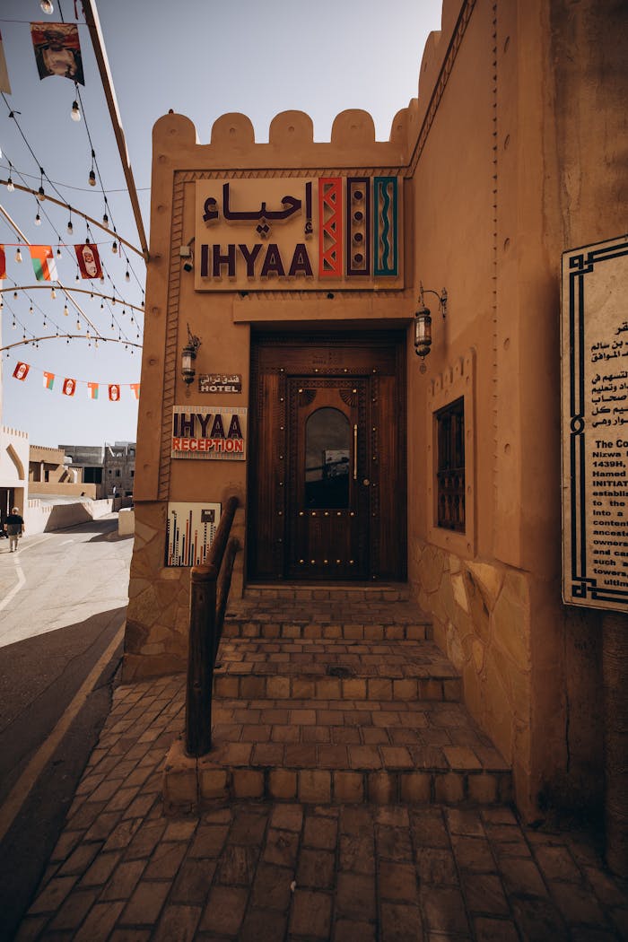 Explore a traditional Omani building with cultural decorations in Nizwa Souq, Oman.